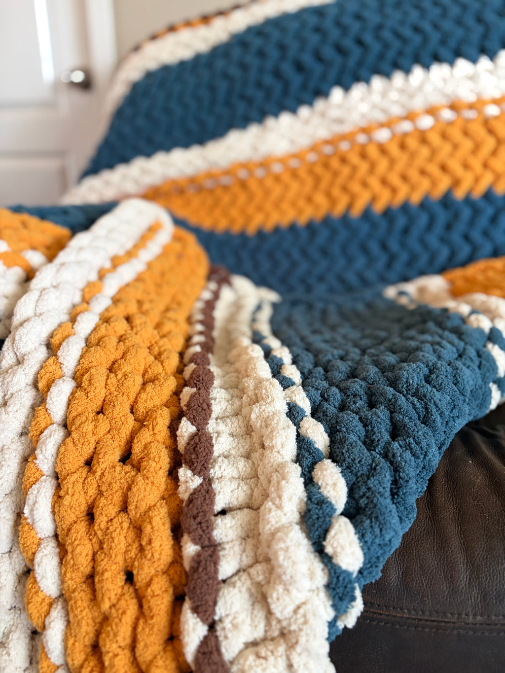 Fields of Grace Chunky Hand Knit Blanket Pattern | 45” x 70” | Herringbone Stitch + Sunflower Embellishment